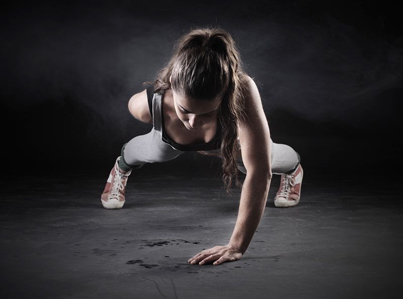 Woman doing One-hand Pushup 1 Woman doing One-hand Pushup 1