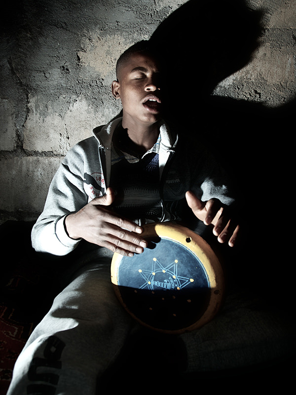 Person Playing a Hand Drum Person Playing a Hand Drum